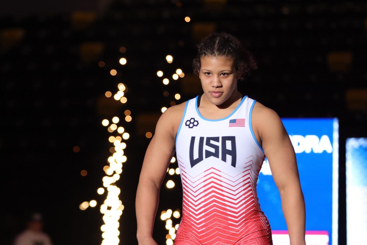 Alexandria Alli walks out to the mat before her match’s start. Alli is a part of Team USA’s Elite Accelerator Program that prepares young wrestlers to be future World and Olympic Champions. She recently committed to Lehigh University.