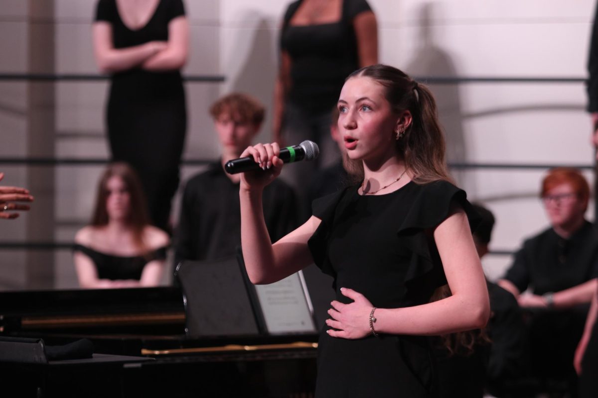 Lily Colleran '28 sings a duet with Lydia Tanas '28 in "Great Expectations."