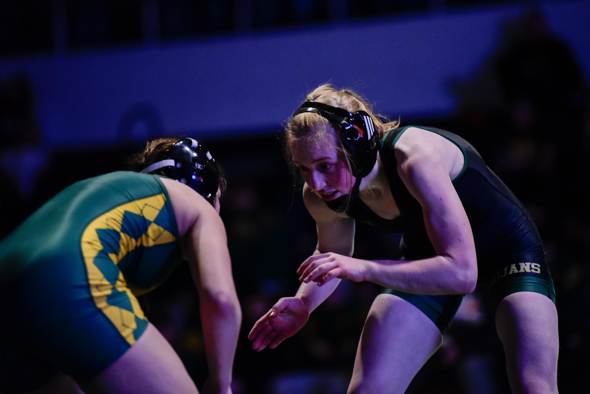 Under the lights, Kaylee Hampton '28 wrestles off an opponent. Hampton competed with her team against Cedar Rapids Kennedy Jan. 22.