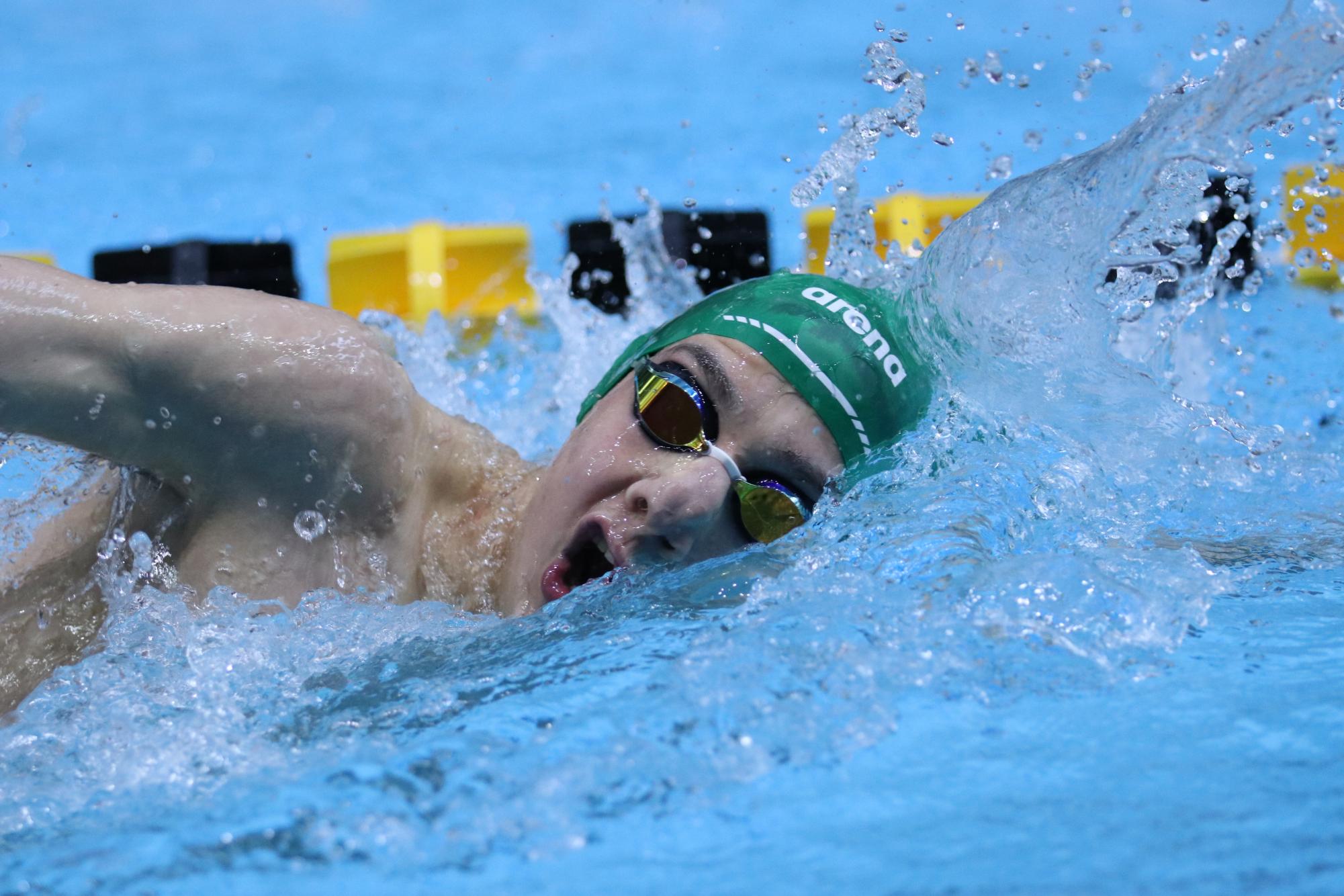 Splashing in the pool with grace, Nikolai Paulson ’26 pushes through the 500 Yard Freestyle Feb. 14. Through the hard race, Paulson finished 16th with a time of 5.01.27.