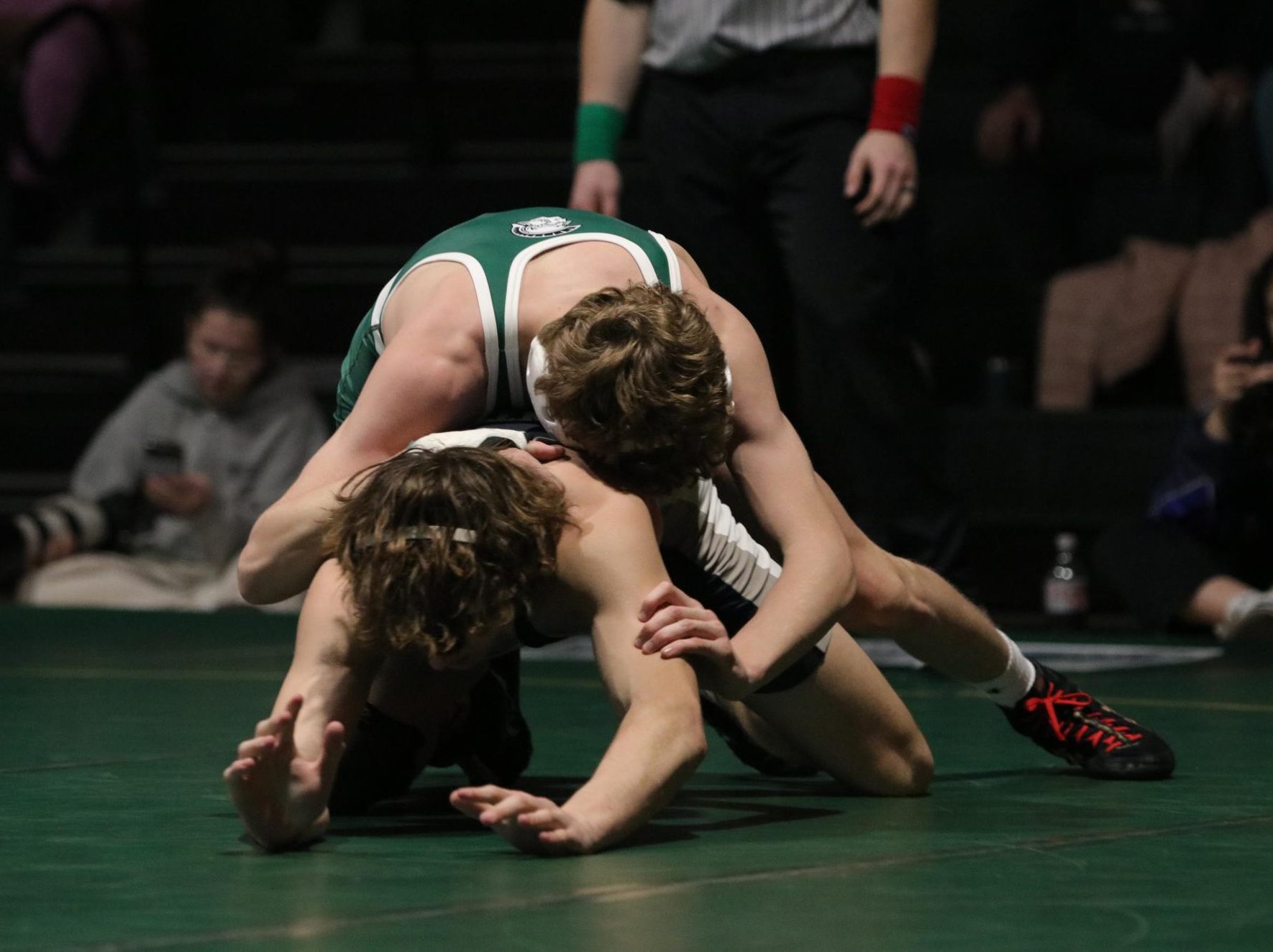 Charles Barnhouse '27 breaks his opponent down from the top positon Jan. 8. 