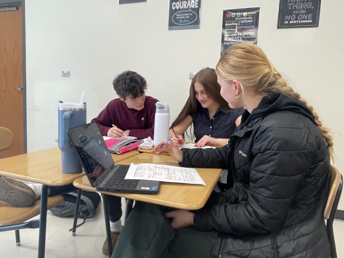 Kate Van Waning '26 tutors Algebra II students in Gelene Smutz's AFT.