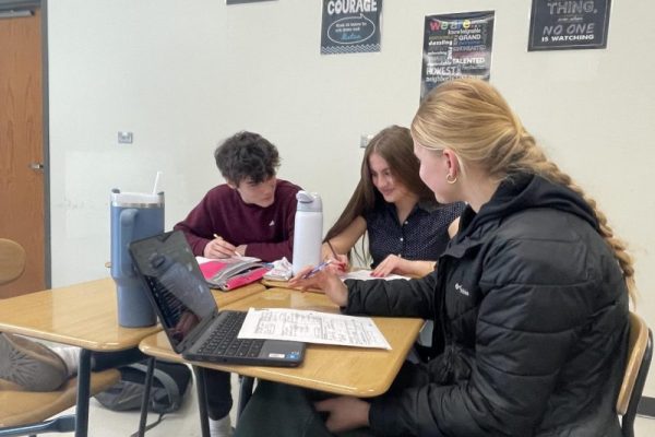 Kate Van Waning '26 tutors Algebra II students in Gelene Smutz's AFT.