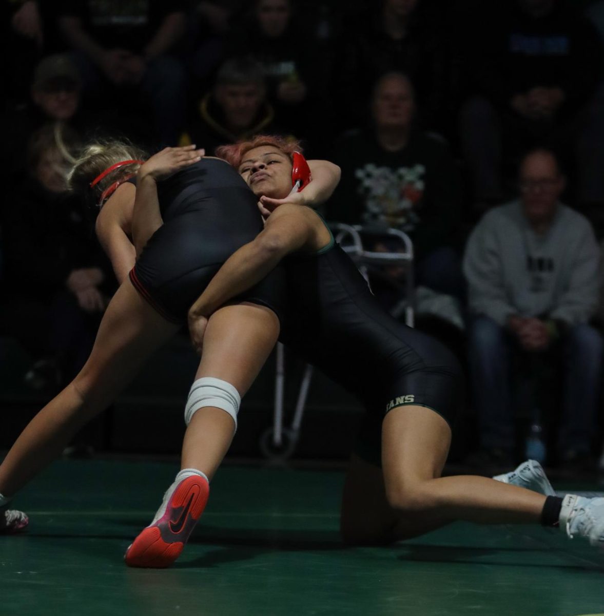 Brianna Lucero '27 attempts to take down her opponent from Linn Mar Dec. 15. 