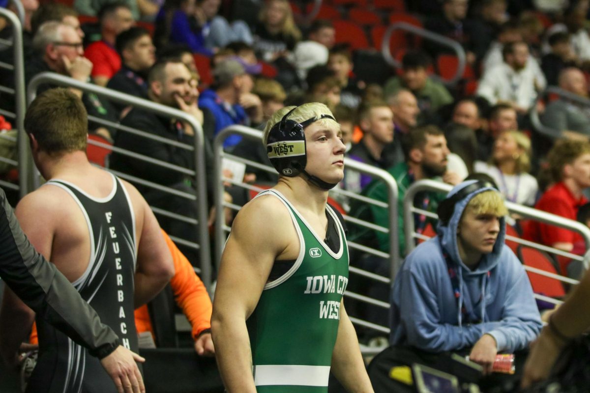 Campbell Janis '26 prepares for his state match Feb. 20.