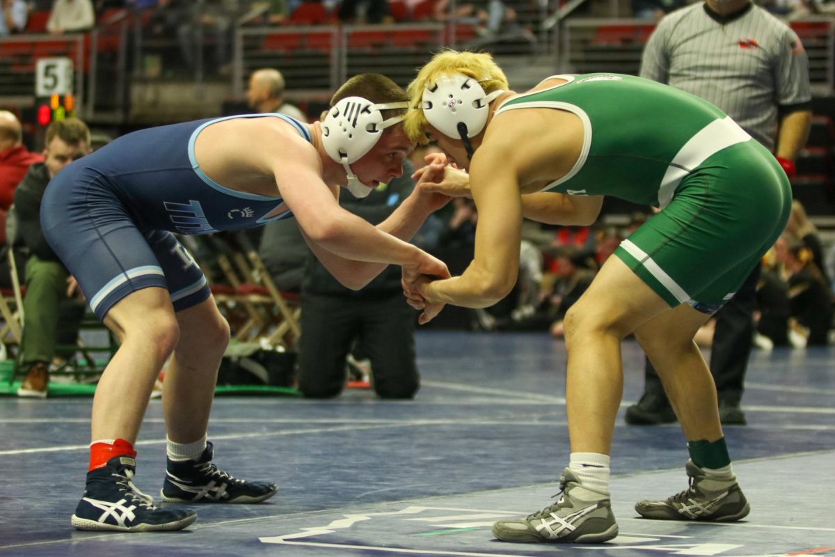 Alexander Pierce '26 hand-fights his opponent in his state semifinal match.