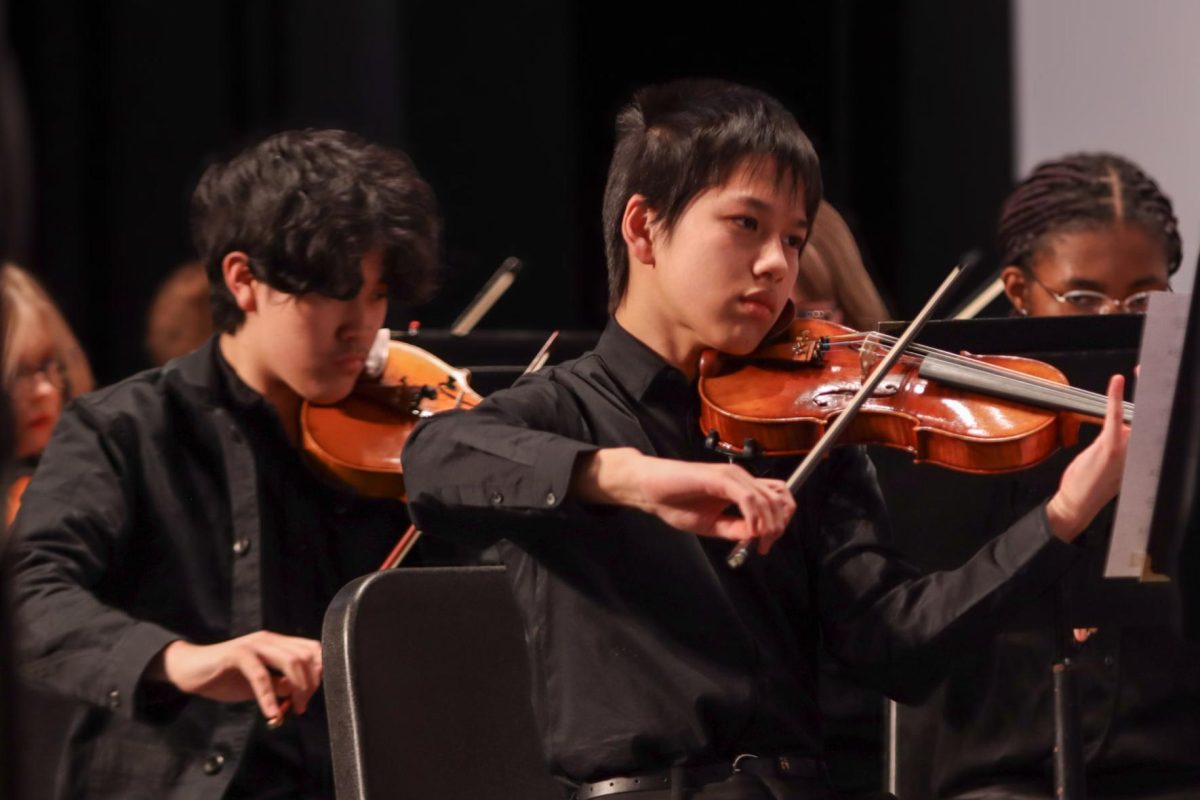 Freshman Thomas Gao plays the violin in Philharmonic Strings Feb. 26.