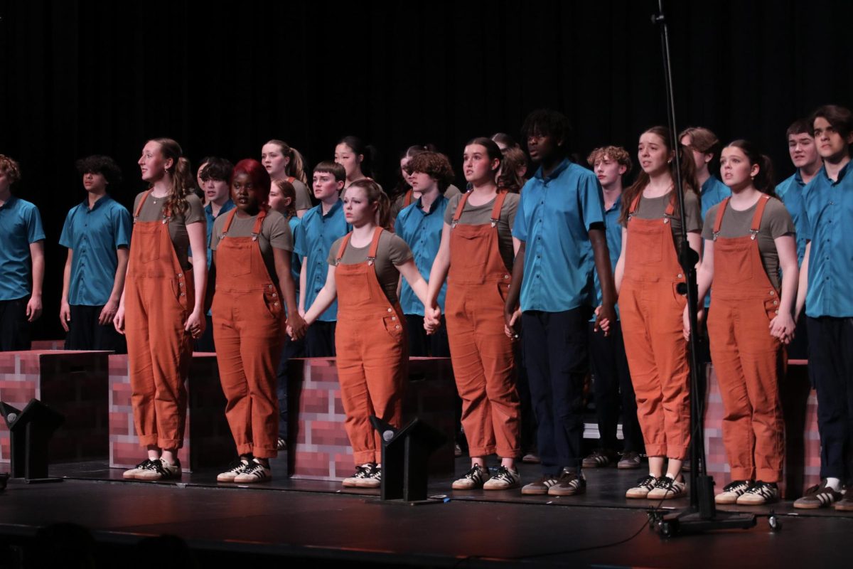 Good Time Company stands together during their ballad, with seniors joined together in the front. Singer-dancers finished a successful year at the Spring Swing Show March 1, marking seniors' last GTC show.
