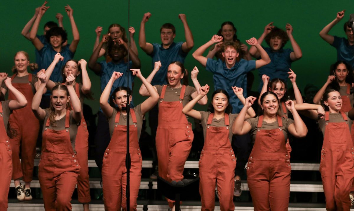 Members of Good Time Company dance together during their set "Minecraft" at Choirs For A Cause Jan. 7. The group traveled to five competitions this year, along with their crew and band.