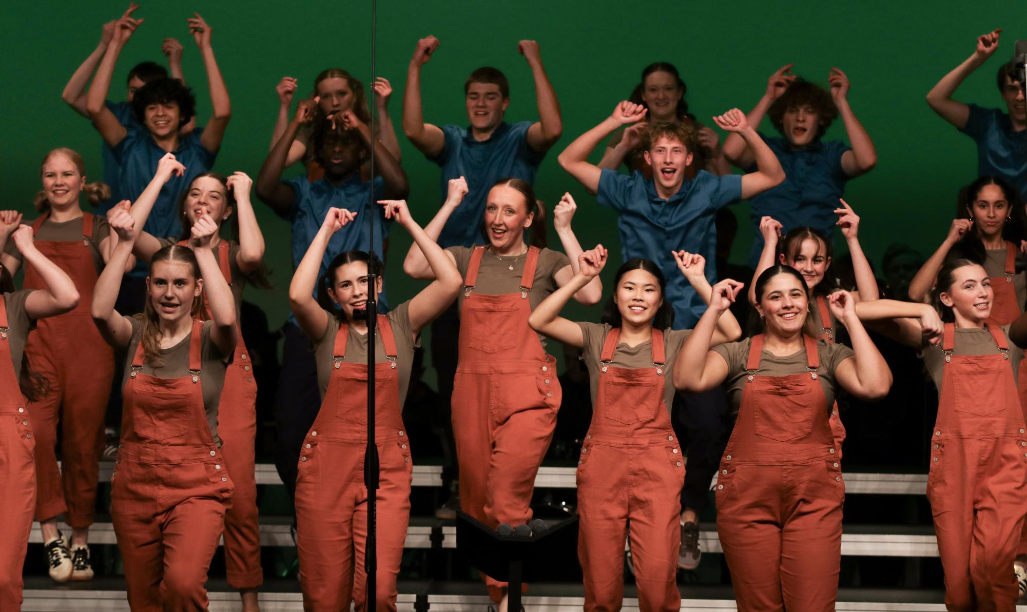 Members of Good Time Company dance together during their set "Minecraft" at Choirs For A Cause Jan. 7. The group traveled to five competitions this year, along with their crew and band.