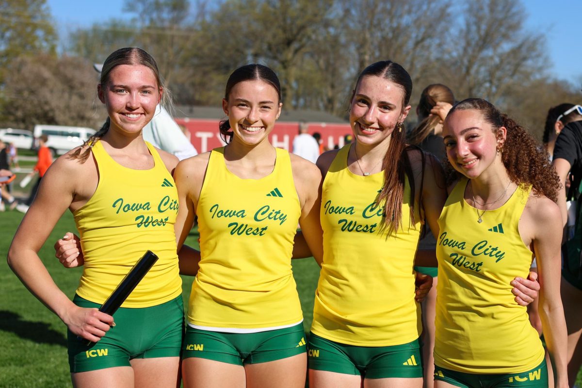 The sprint medley team of Savannah Mathias ’28, Amara MacLagan ’28, Savannah Graham ’28 and Myriam Rahmouni ’29 smile after qualifying for the Drake Relays at the Forwald Relays April 16. The team also broke a 15-year school record with a new record of 1:48.66.