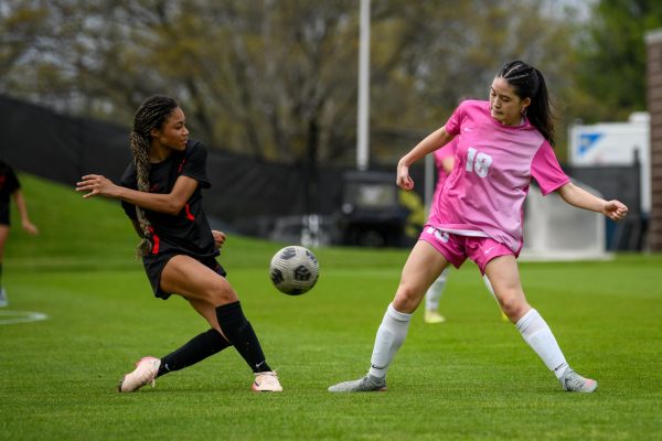 Stepping out, midfielder Brileigh Thorn '28 blocks a pass at the University of Iowa Soccer Complex April 23.