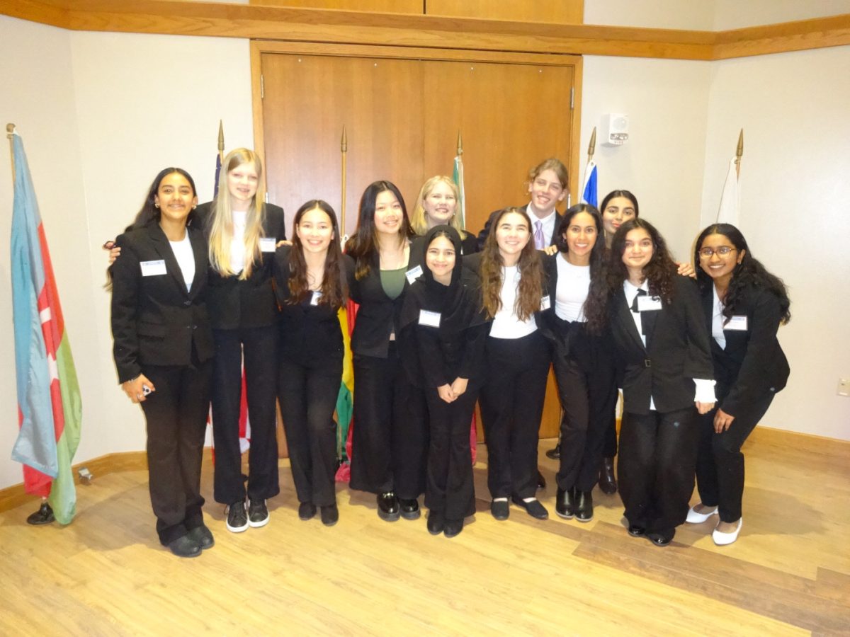 Model UN delegates in West High's freshman class stand in the ballroom for a photo following their first conference. Photo courtesy of Bibisha Aryal.