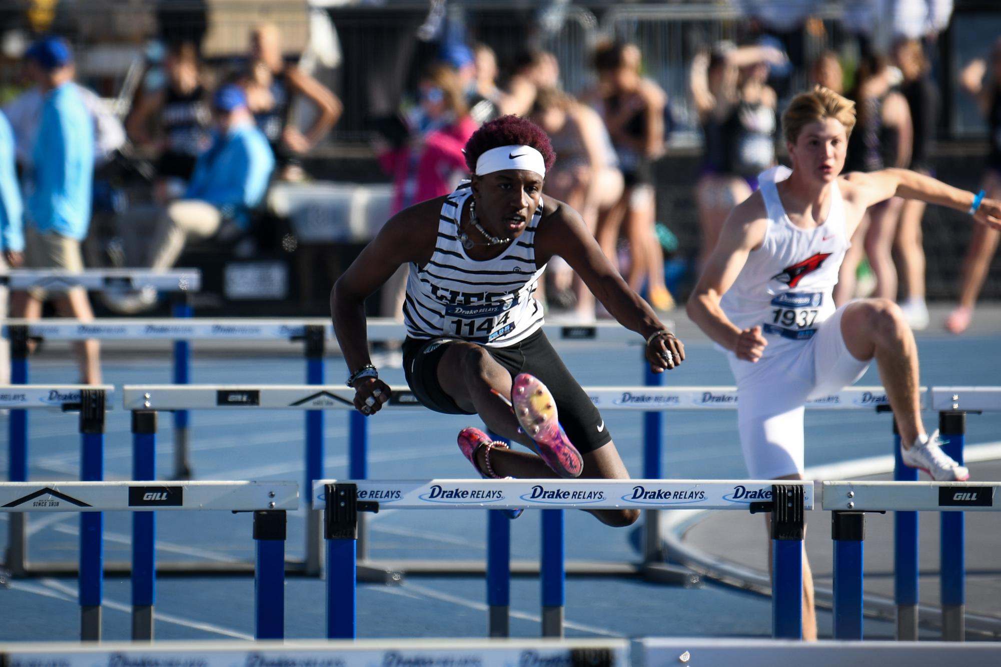 Waleed Ibrahim ’26 leaps over the
hurdles as he competes in the shuttle hurdle relay at the Drake Relays. Ibrahim competed April 25 with his relay group.