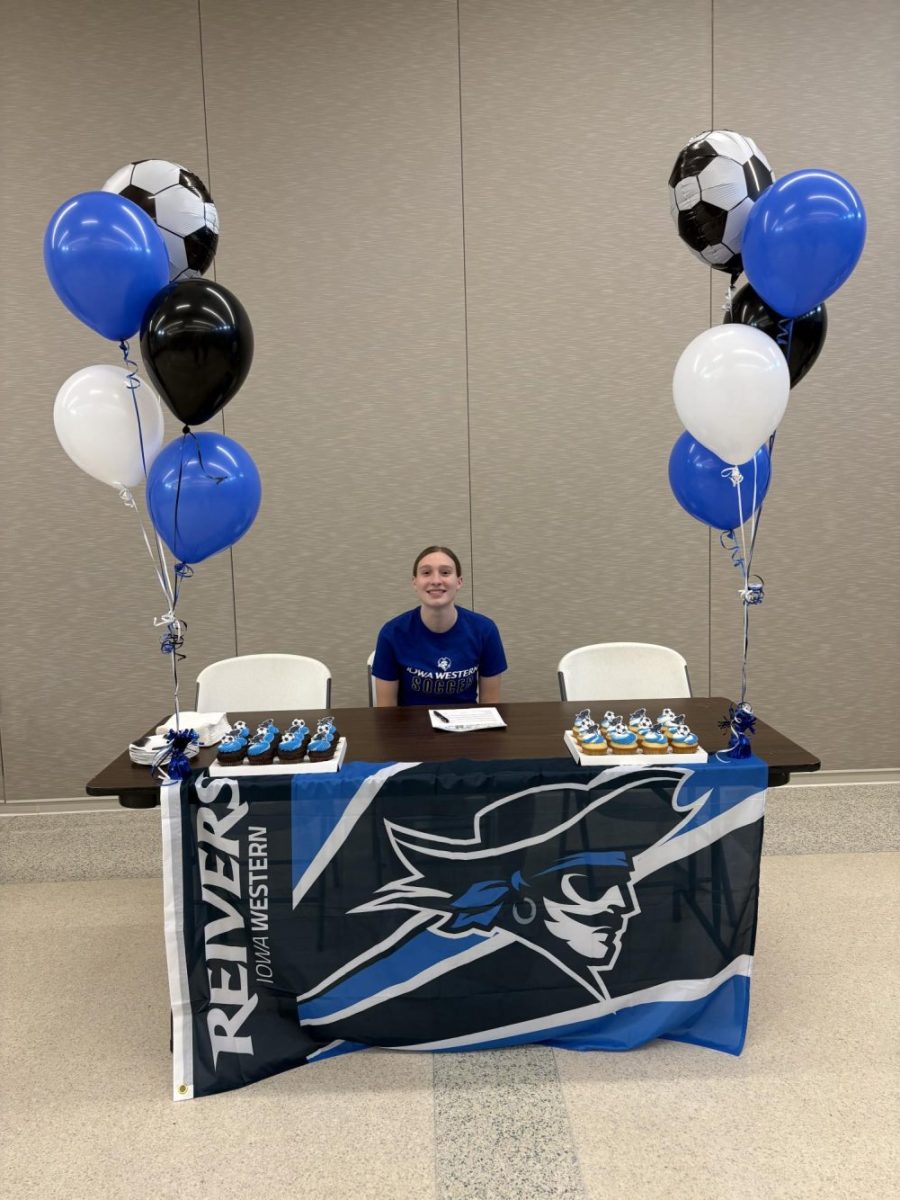 Alex Held '26 smiles for a picture after signing her letter of intent at signing day April 15. Photo courtesy of Alex Held. 