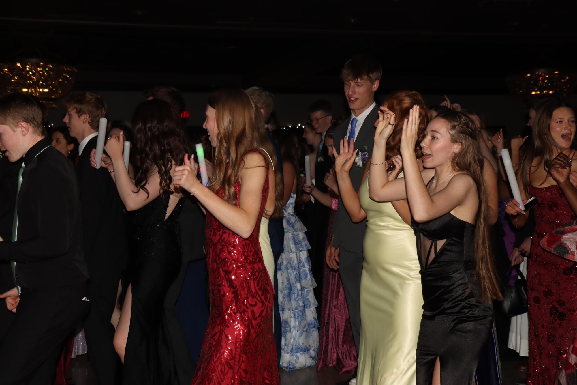 Students shuffle dance together with
light sticks at The Highlander Hotel May
2. Throughout the night, the DJ played a
variety of songs.