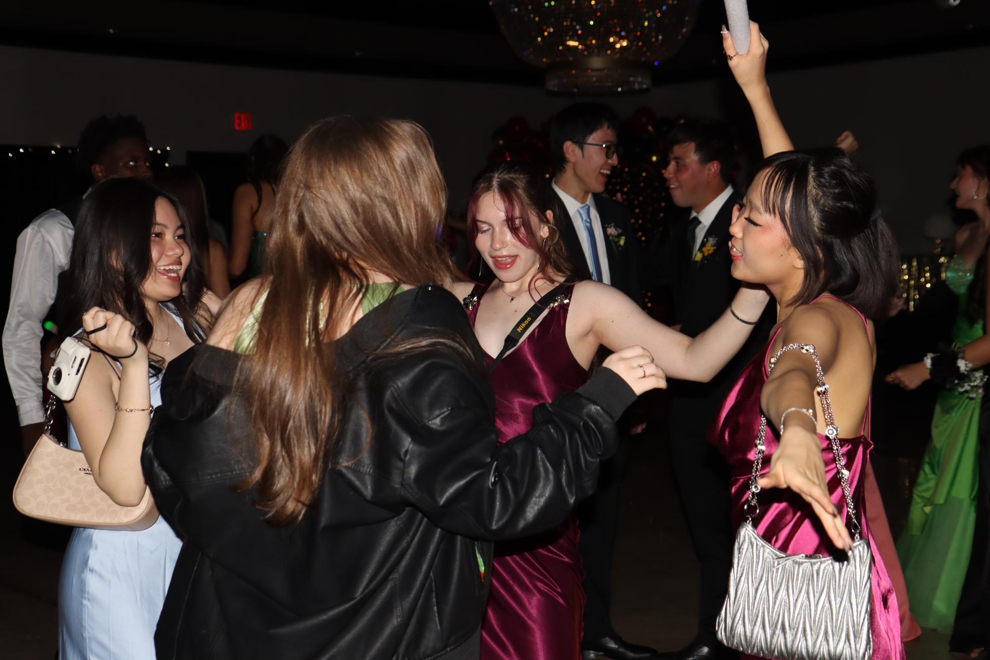 West High students Chantel Abellana ’27, Riley Miller ’27, Josie Nabhan-Warren ’27 and Isun Shim ’27 dance the night away at prom May 2. This year, the party was held at The Highlander Hotel in Iowa City before the party after prom.