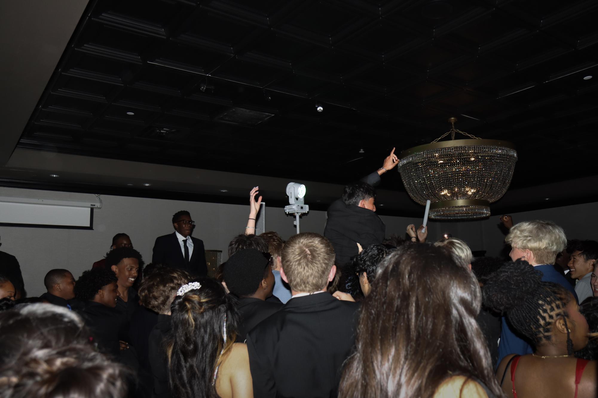 A student crowdsurfs at West's prom. The party was held May 2 at The Highlander Hotel.