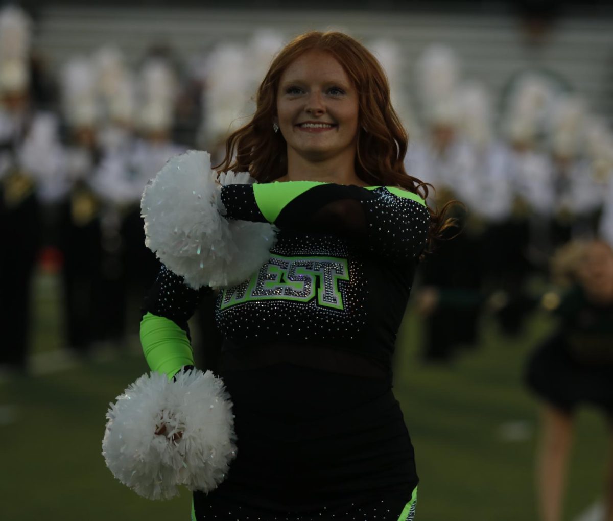 In her routine stance, Hallei Praska '26 dances at a West football game Sept. 26. 