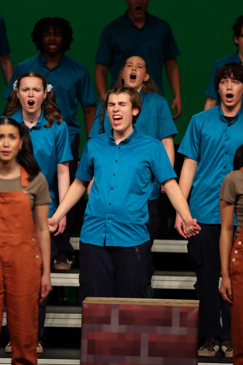Passionately singing, Luke Reimer '27 performs "Sweeden" / "Sound of Silence" / "My Songs Know What You Did in the Dark" at Choirs for a Cause Jan. 7. 
